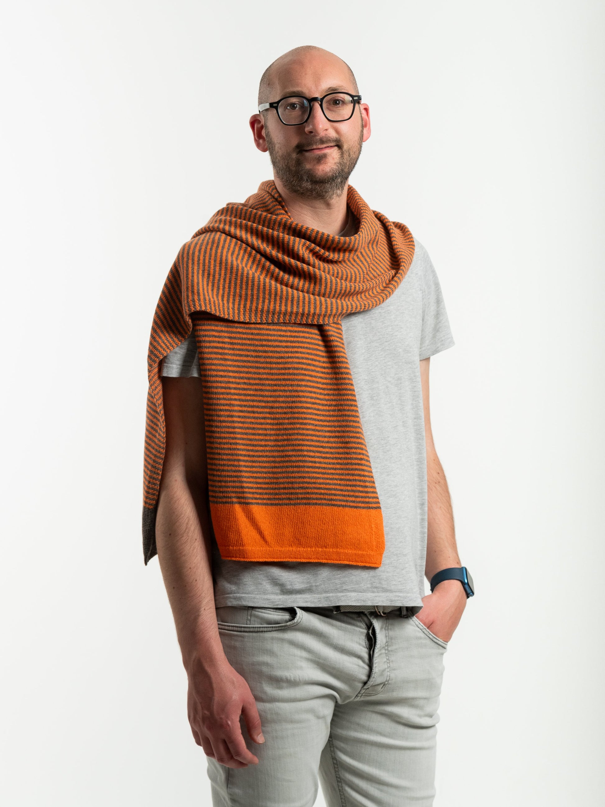 woman wearing merino wool orange and brown stripe scarf - Woolkind