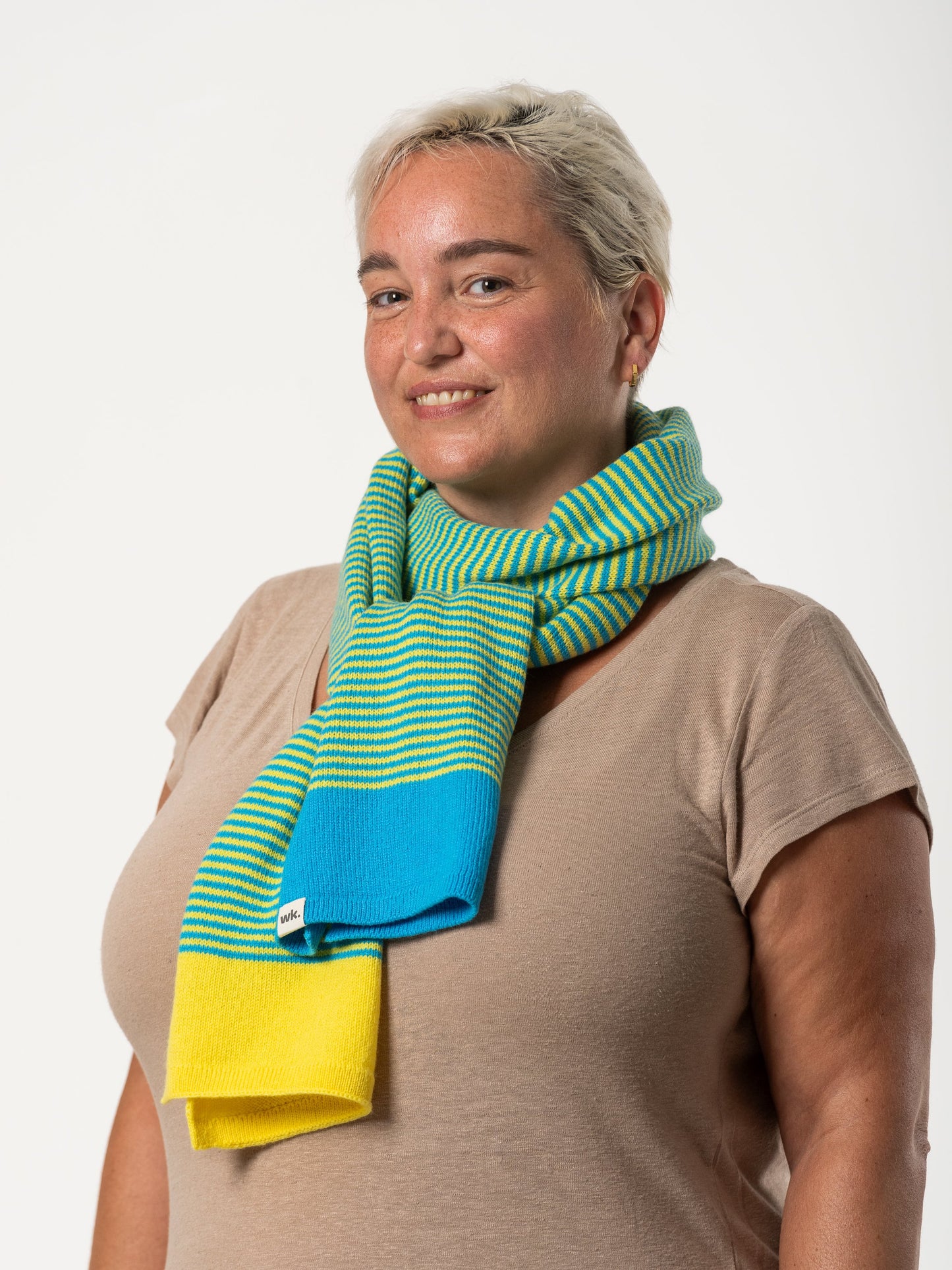 woman wearing merino wool yellow and blue stripe scarf - Woolkind