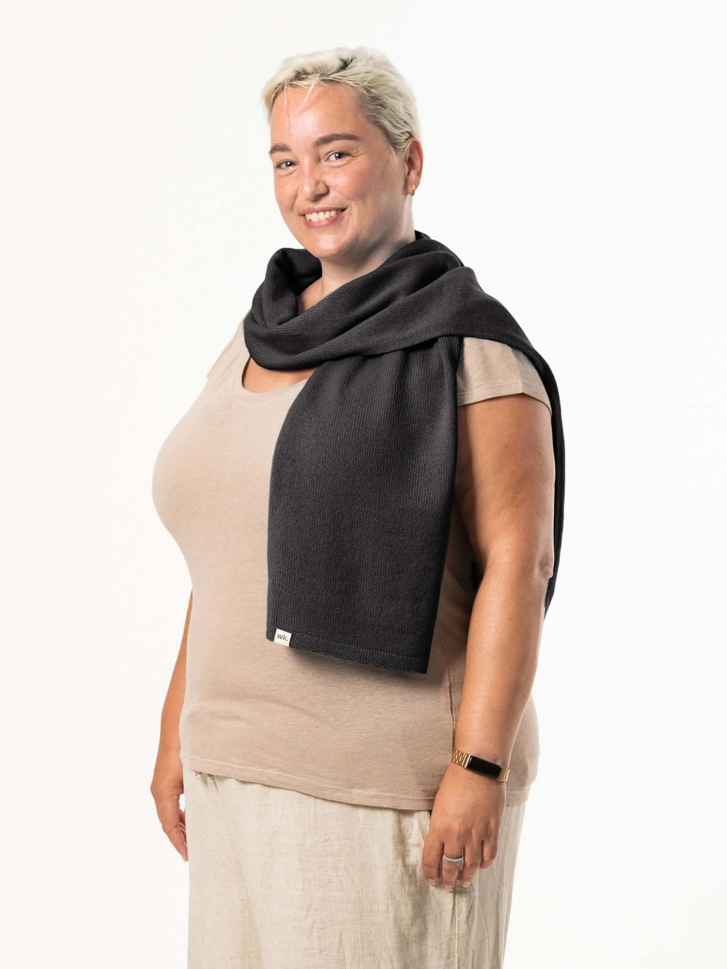 White woman wearing a lightweight quality black merino wool scarf - woolkind
