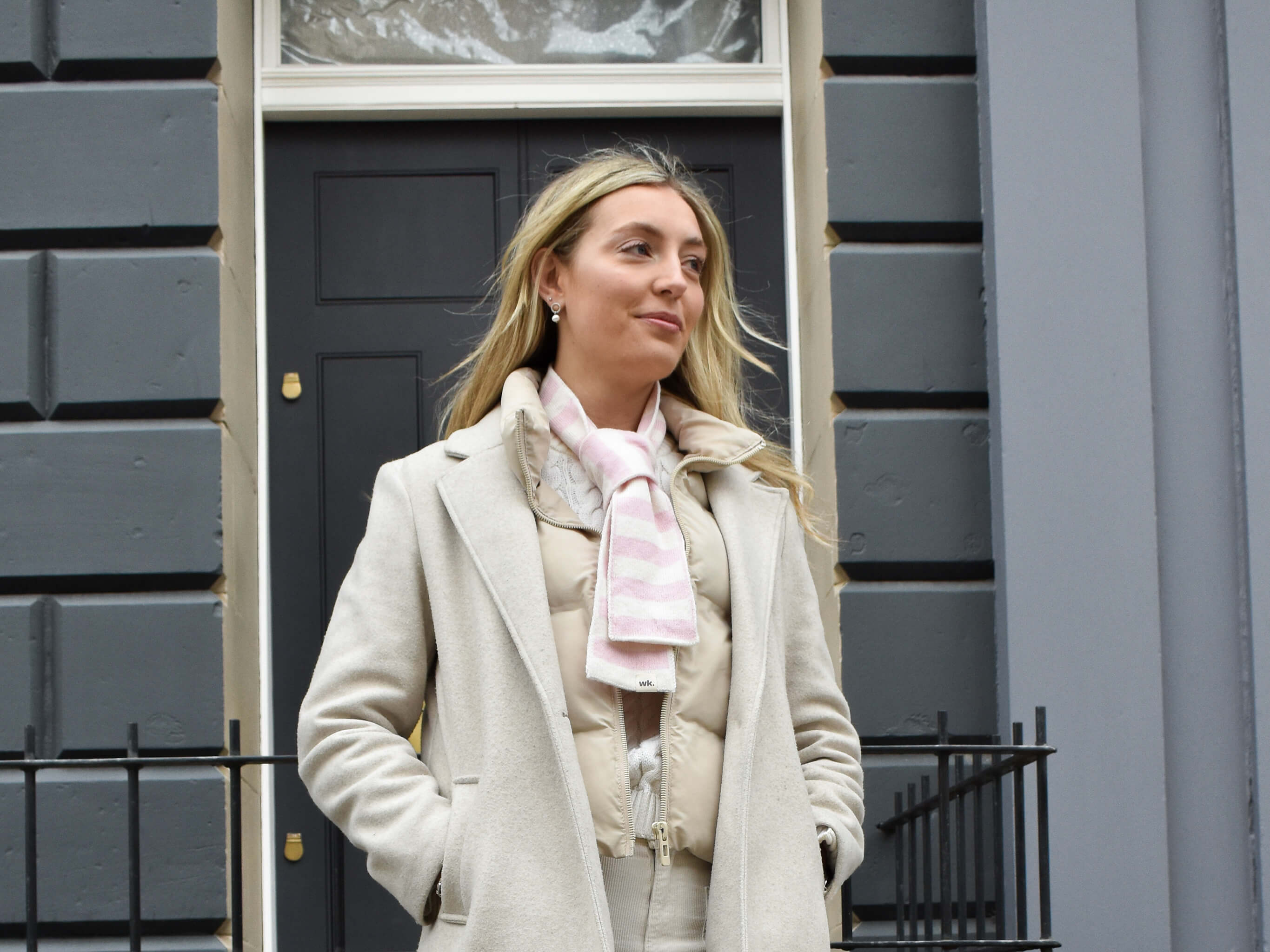 white woman wearing skinny thin merino wool striped neck scarf in pink - woolkind