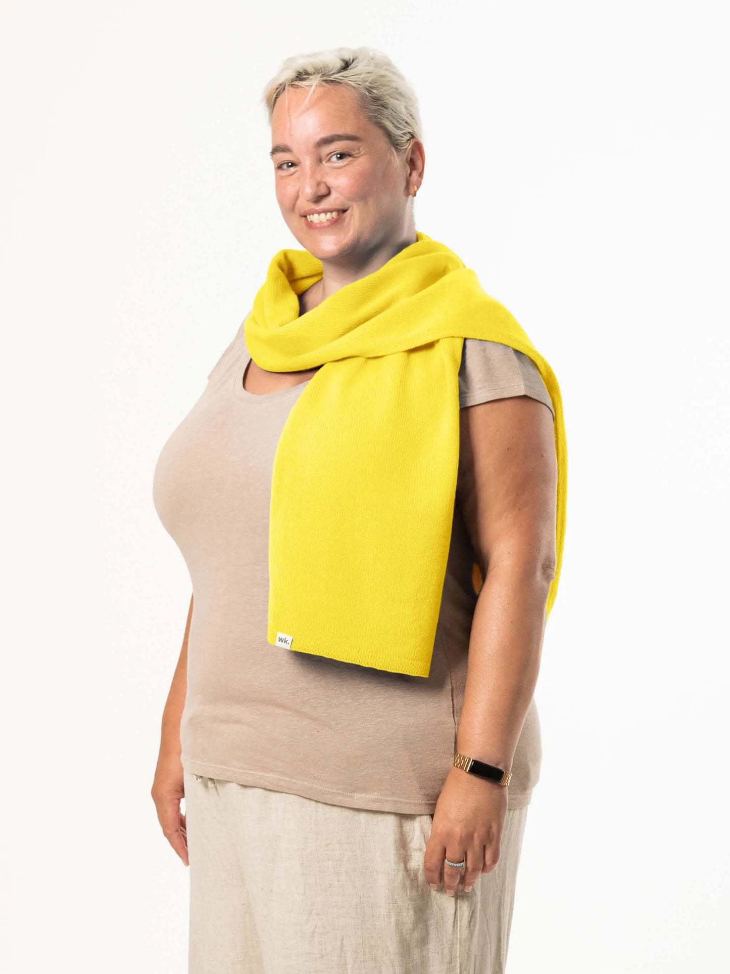White woman wearing a lightweight quality yellow merino wool scarf - woolkind