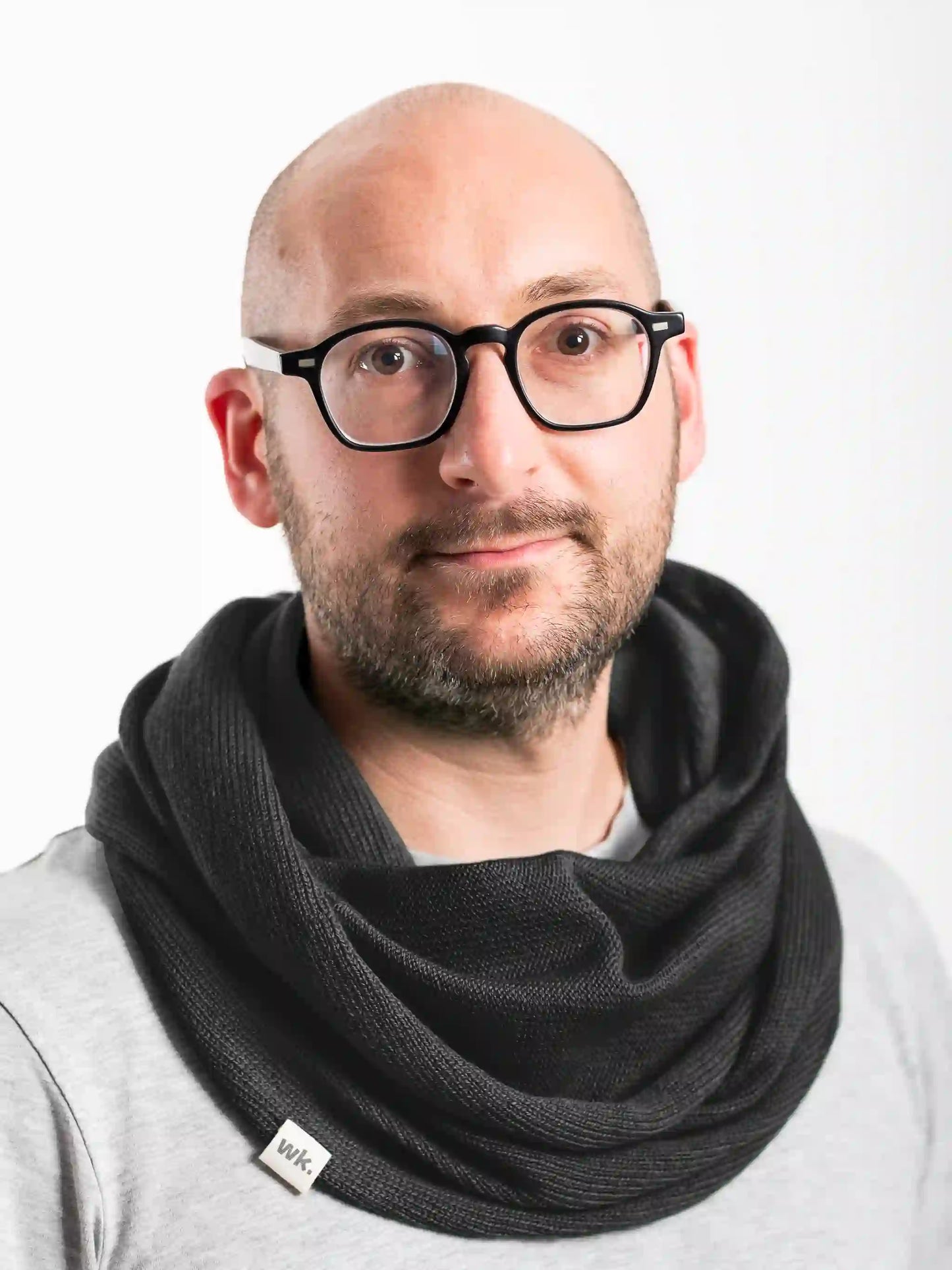 man wearing black merino wool infinity scarf - Woolkind