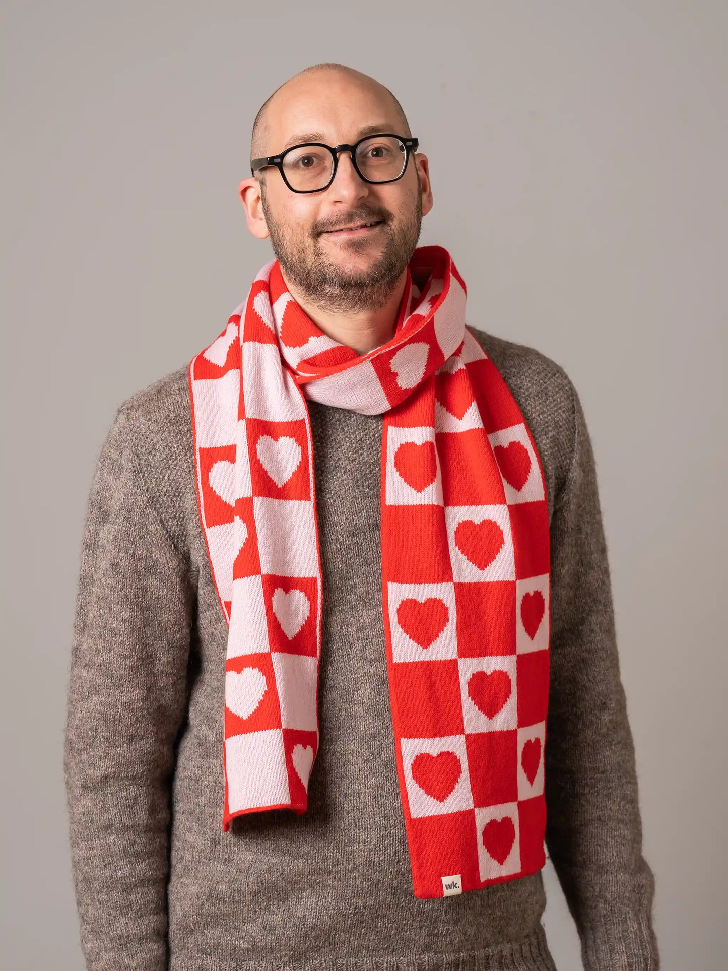 man wearing merino wool love heart scarf in red and white - Woolkind