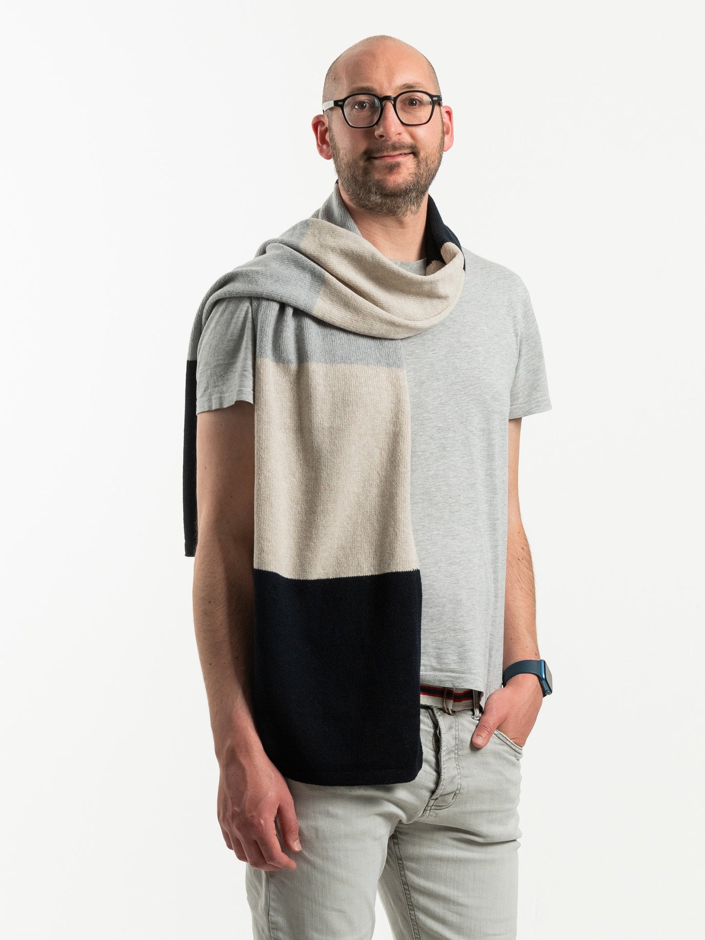 white man wearing a navy and grey merino wool scarf - Woolkind