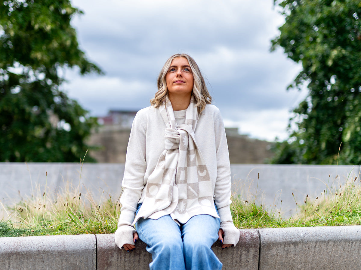 woman wearing cream and beige chequerboard merino wool scarf - woolkind