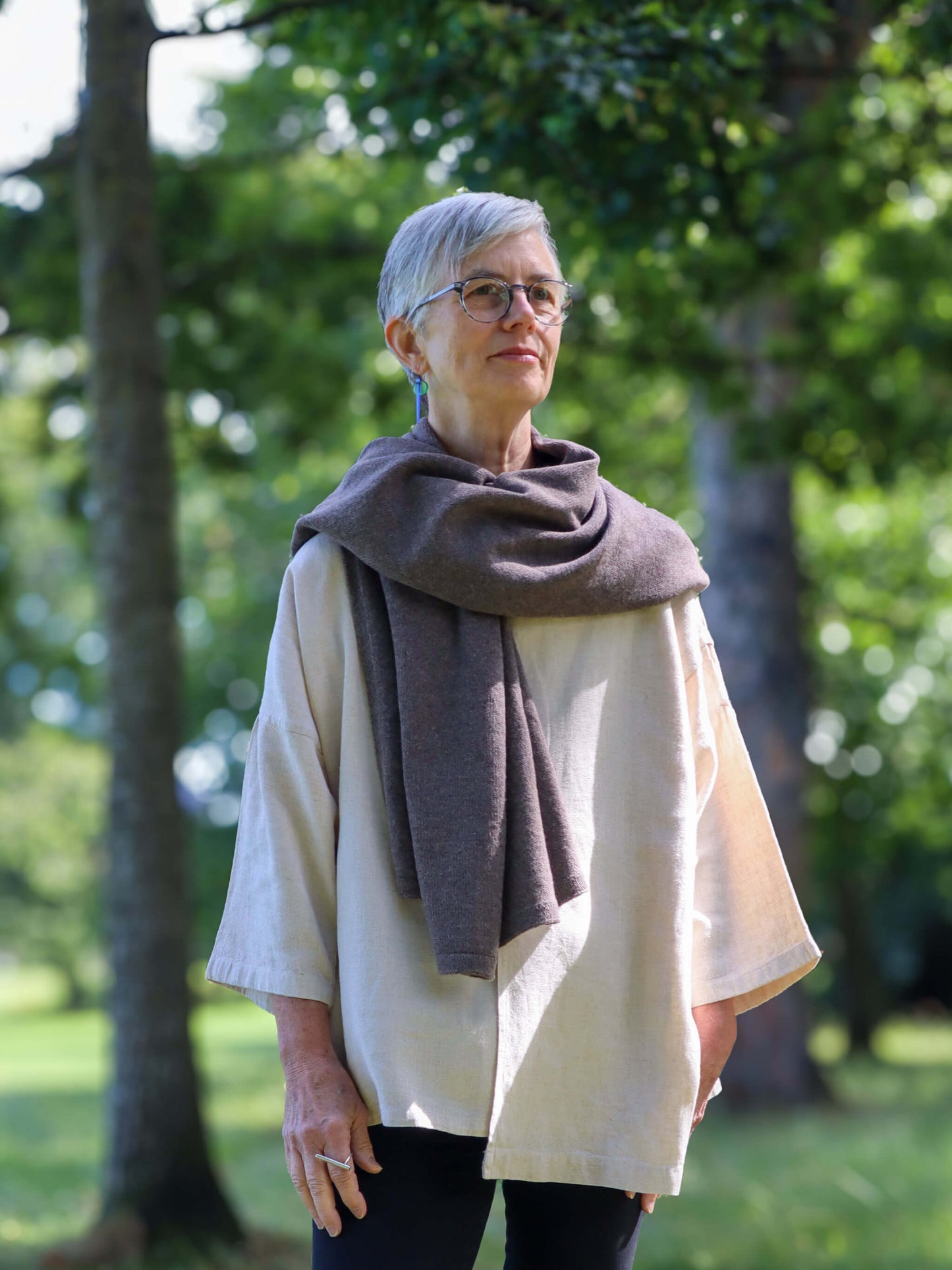 woman wearing oversized knitted brown merino wool wrap - Woolkind