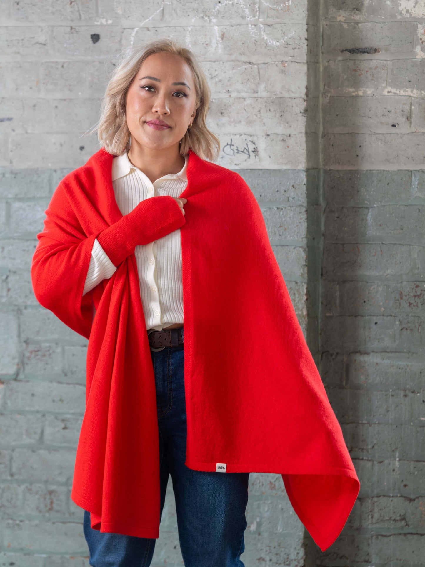 woman wearing oversized knitted red merino wool wrap - Woolkind