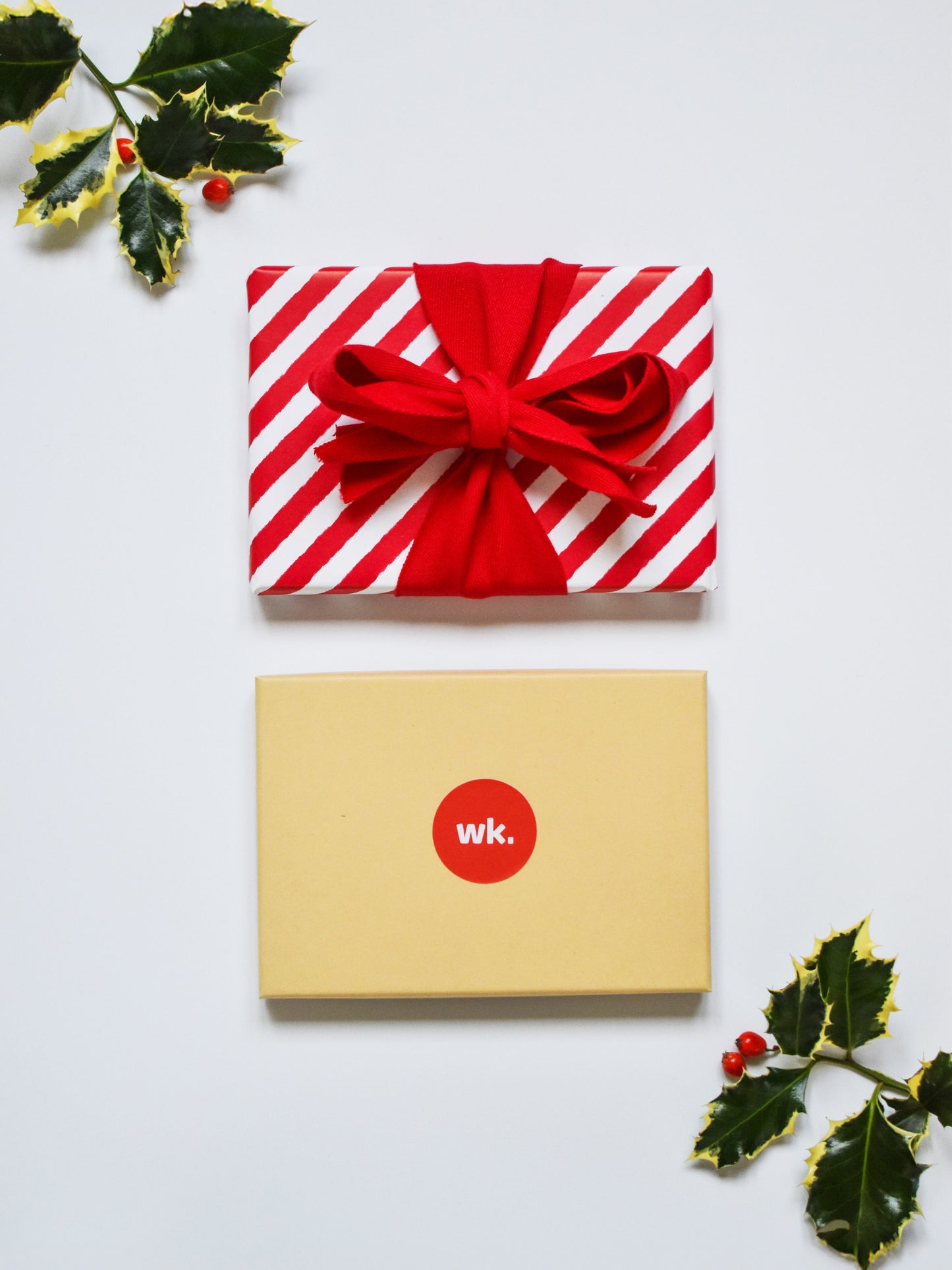 Physical woolkind gift box wrapped in paper and a bow ready for a Christmas present