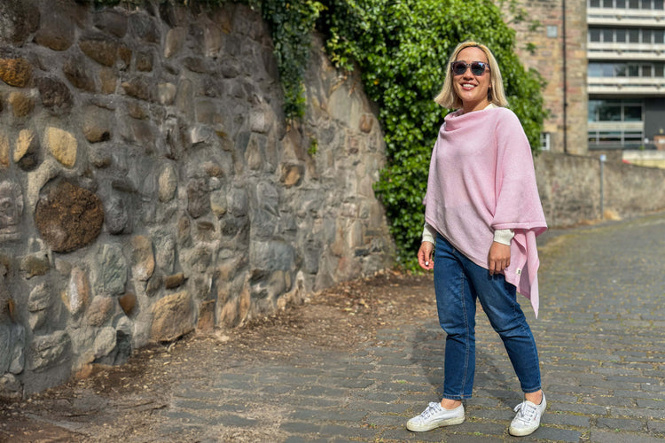 woman wearing pink merino wool poncho