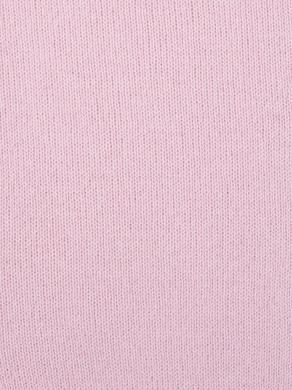 a swatch of plain single jersey knitting made from fine merino wool in a pale pink colour