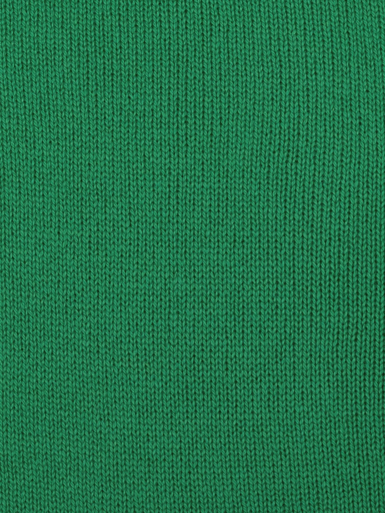 a swatch of plain single jersey knitting made from fine merino wool in a green colour