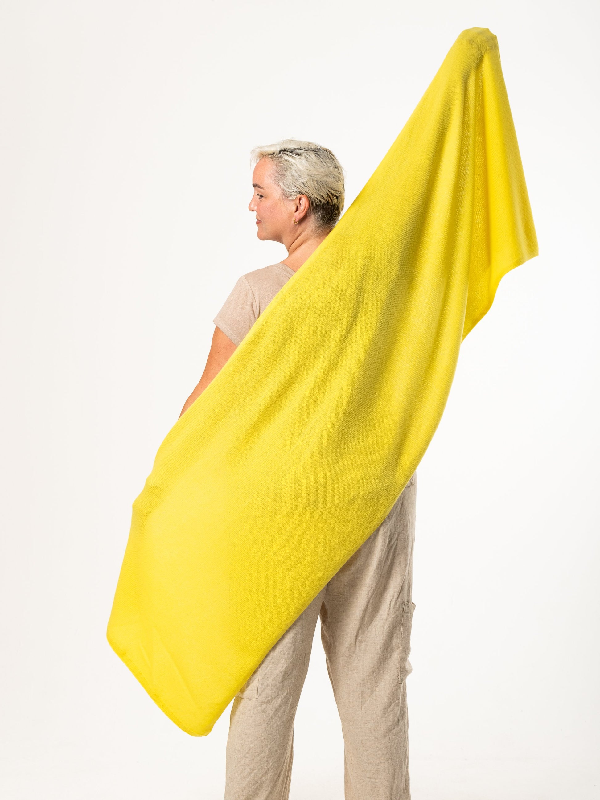 woman wearing yellow merino wool wrap - woolkind