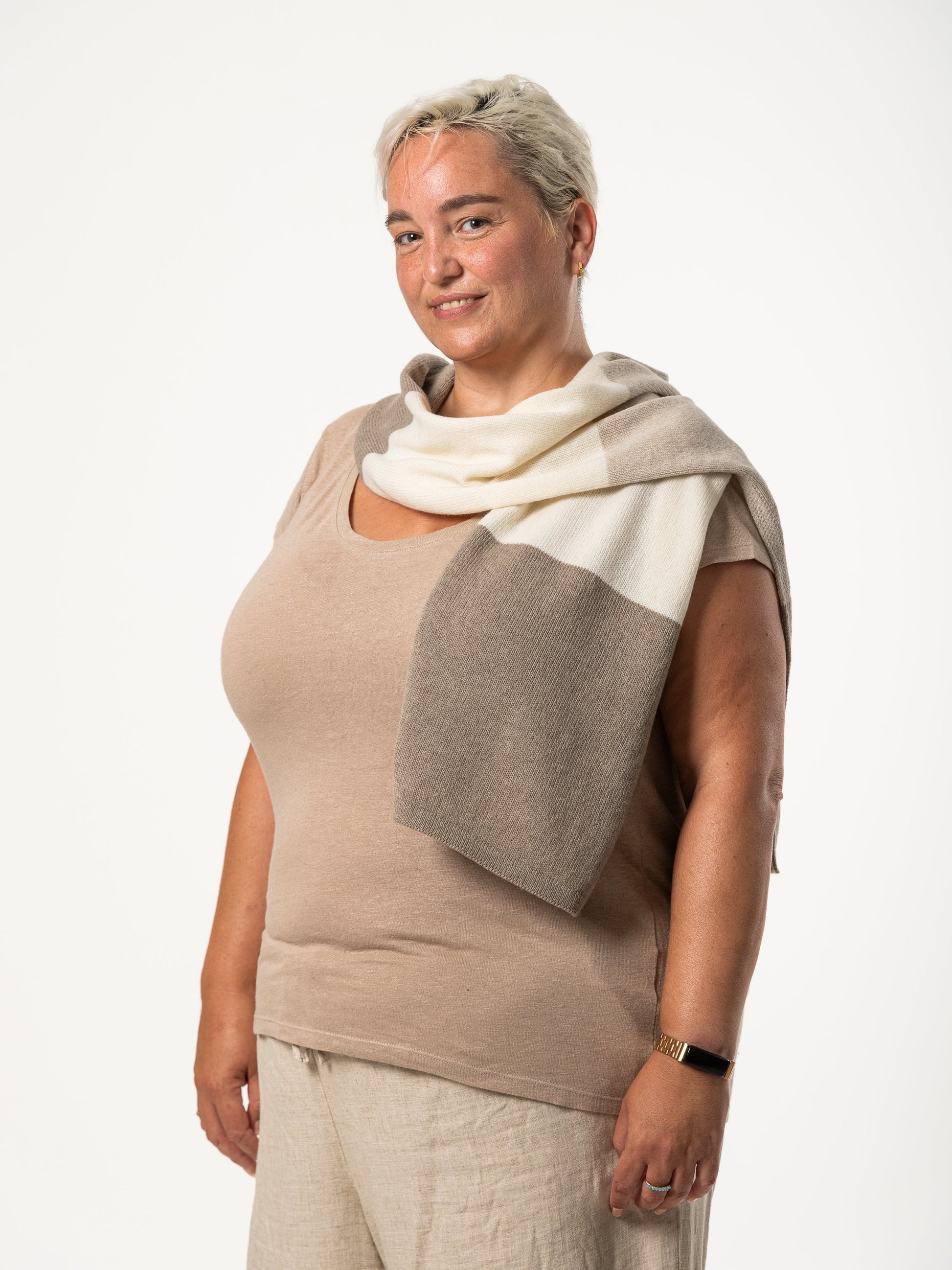 white woman wearing a cream and grey merino wool scarf - Woolkind