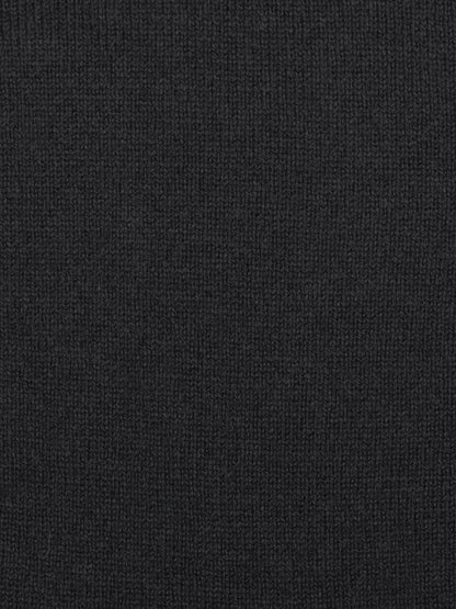 a swatch of plain single jersey knitting made from fine merino wool in a black colour