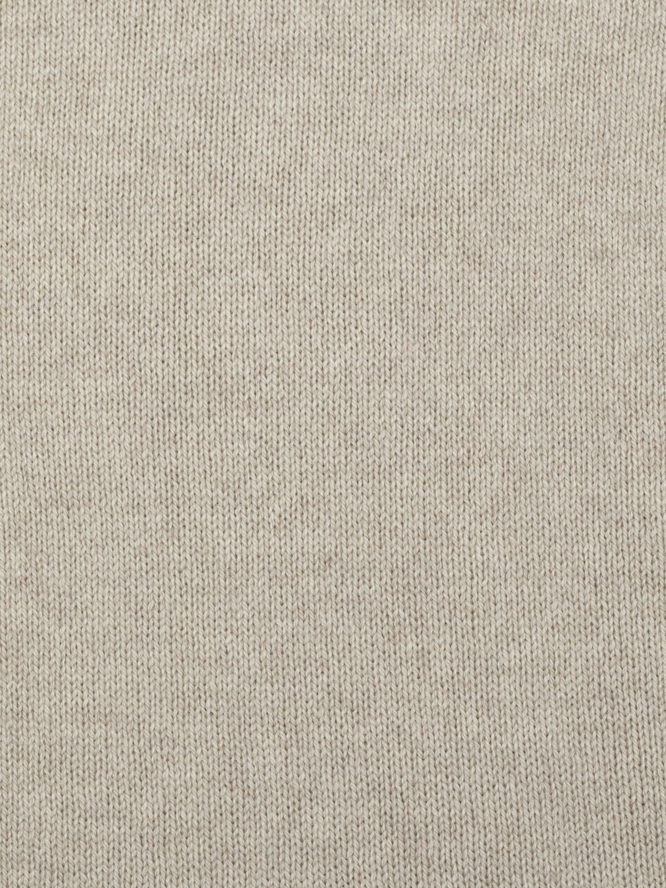 a swatch of plain single jersey knitting made from fine merino wool in a light brown colour