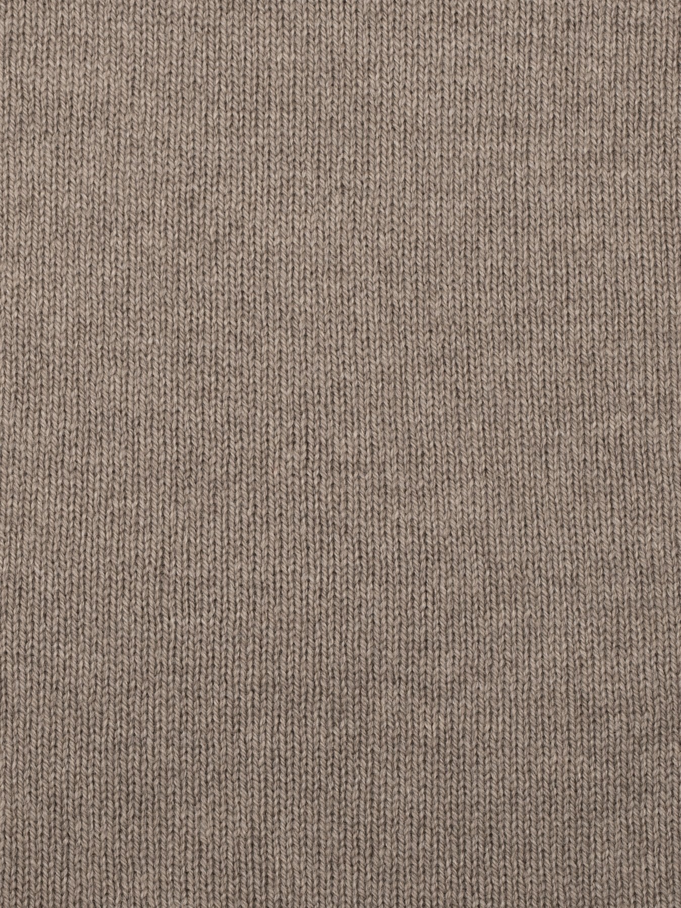 a swatch of plain single jersey knitting made from fine merino wool in a medium brown colour