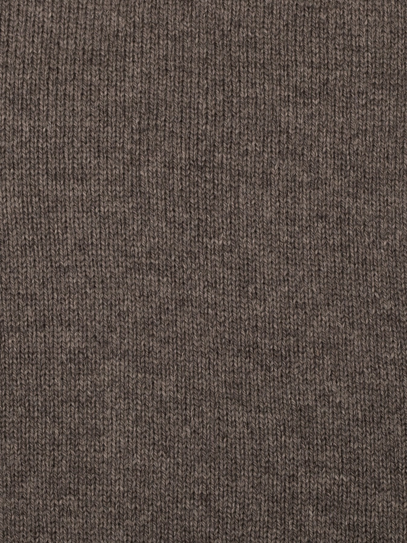 a swatch of plain single jersey knitting made from fine merino wool in a dark brown colour