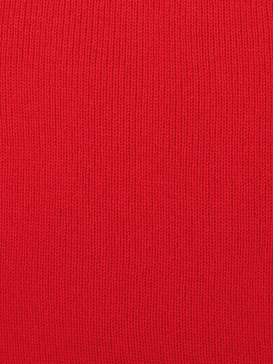 a swatch of plain single jersey knitting made from fine merino wool in a red colour