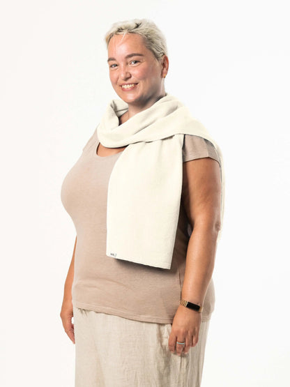 White woman wearing a lightweight quality cream merino wool scarf - woolkind