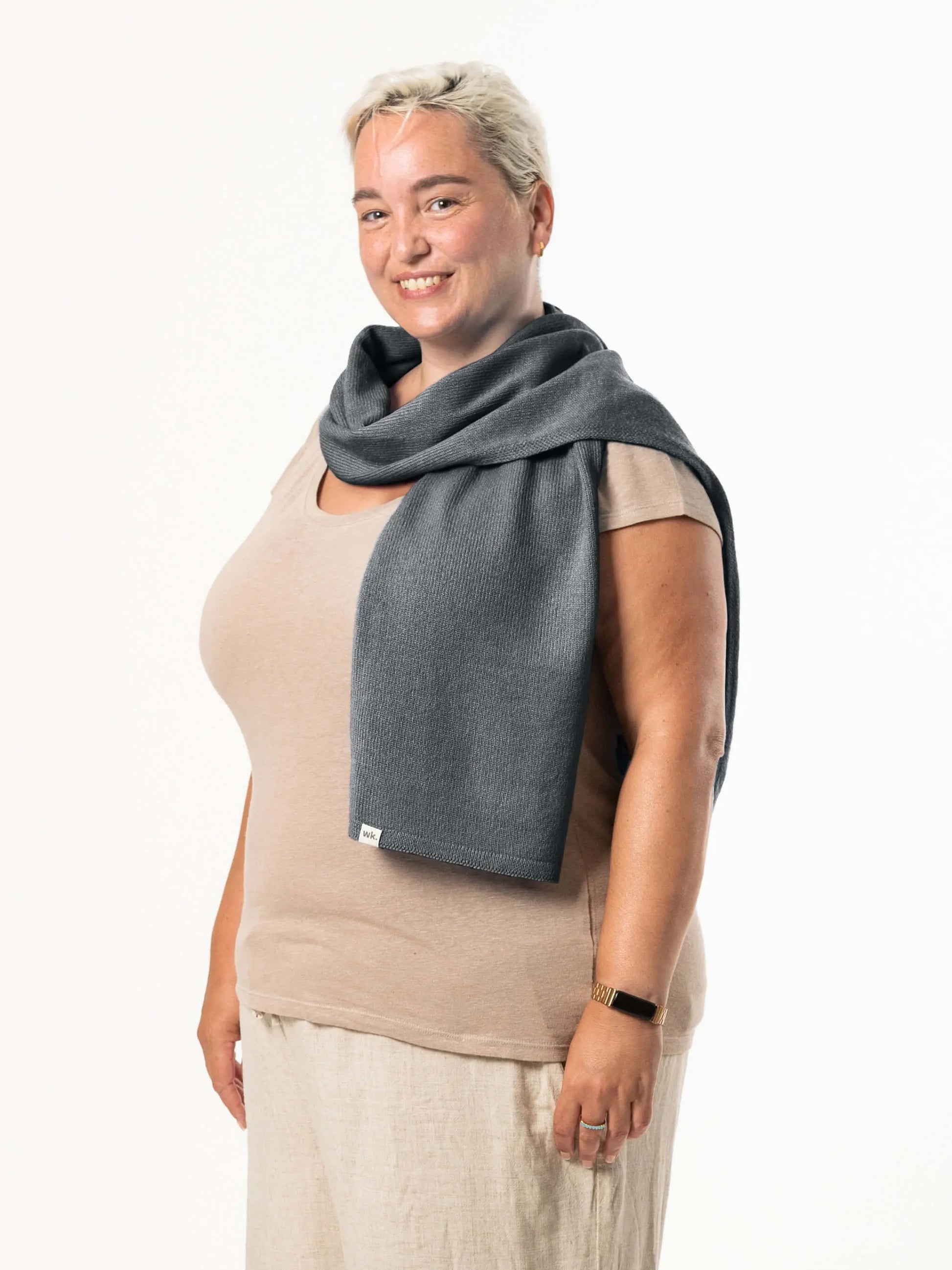 White woman wearing a lightweight quality dark grey merino wool scarf - woolkind