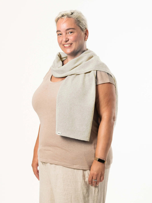 White woman wearing a lightweight quality fawn merino wool scarf - woolkind