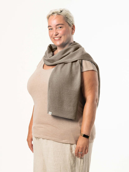 White woman wearing a lightweight quality medium brown merino wool scarf - woolkind