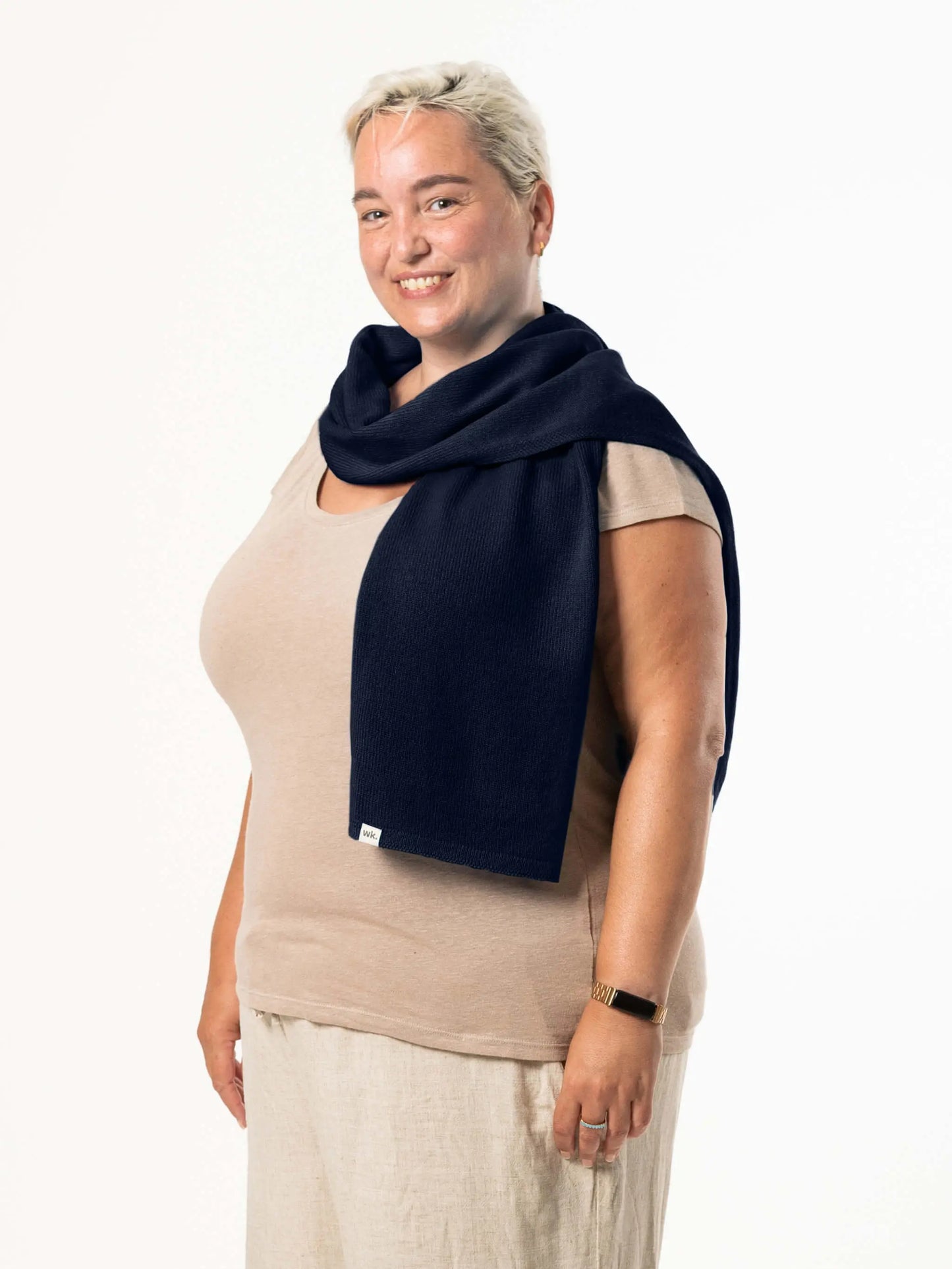 White woman wearing a lightweight quality navy merino wool scarf - woolkind
