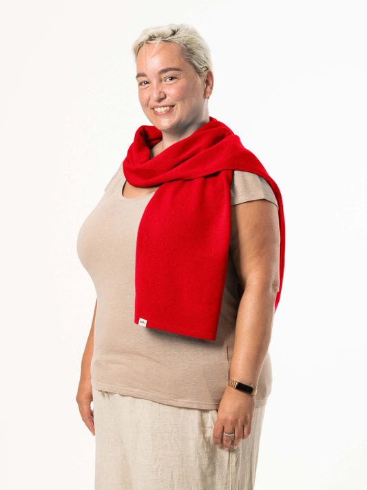 White woman wearing a lightweight quality red merino wool scarf - woolkind