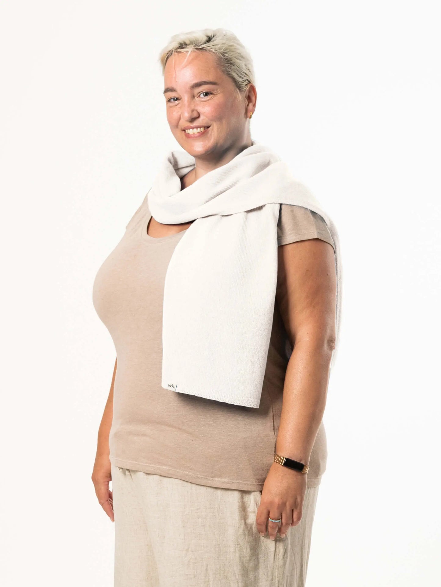 White woman wearing a lightweight quality white merino wool scarf - woolkind