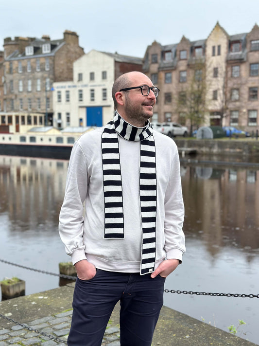 white man wearing navy and cream skinny merino wool stripe scarf - Woolkind