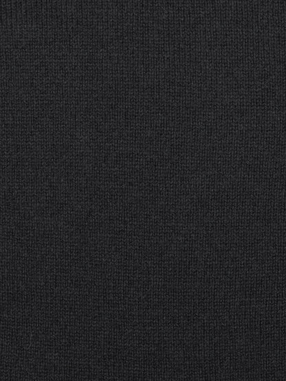 a swatch of plain single jersey knitting made from fine merino wool in a black colour