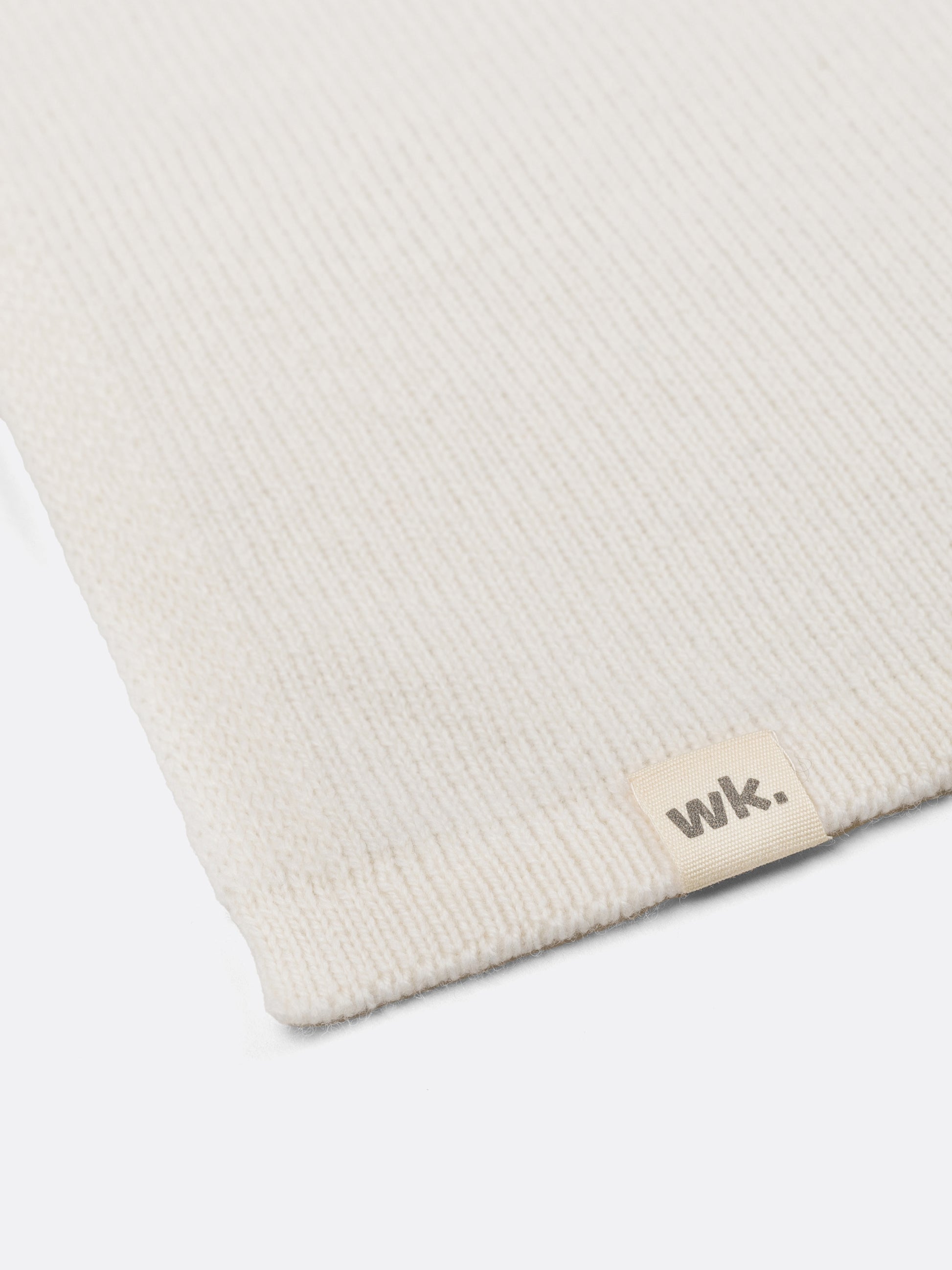 a swatch of plain single jersey knitting made from fine merino wool in a white colour