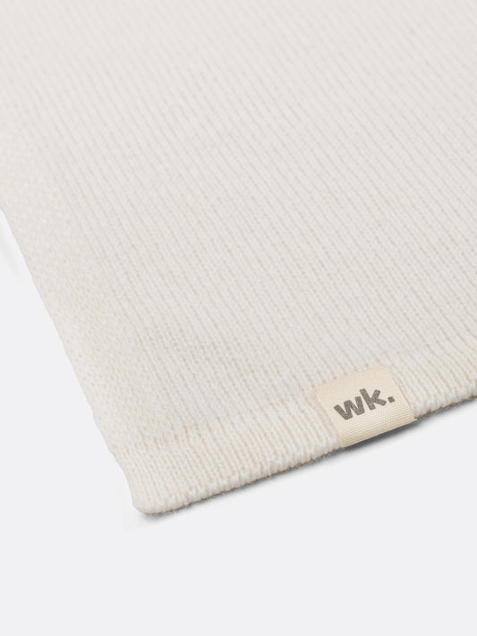 a swatch of plain single jersey knitting made from fine merino wool in a white colour