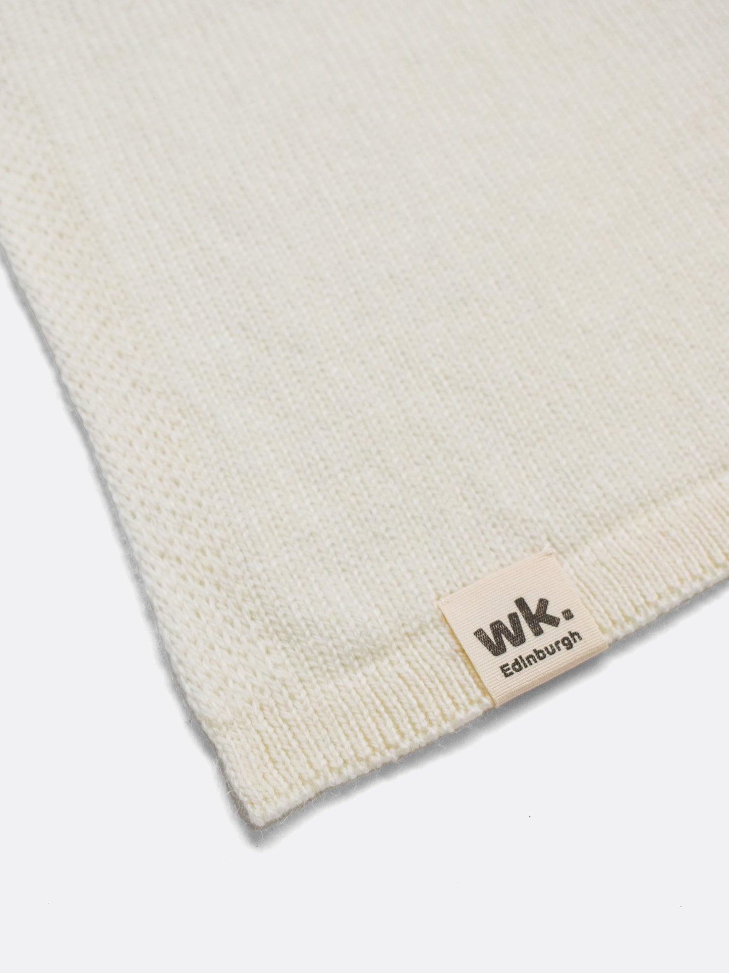 a swatch of plain single jersey knitting made from fine merino wool in a cream colour