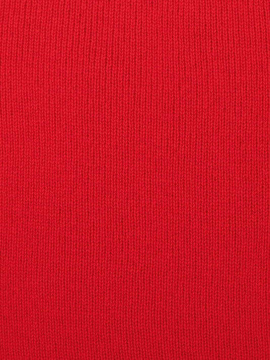 a swatch of plain single jersey knitting made from fine merino wool in a red colour