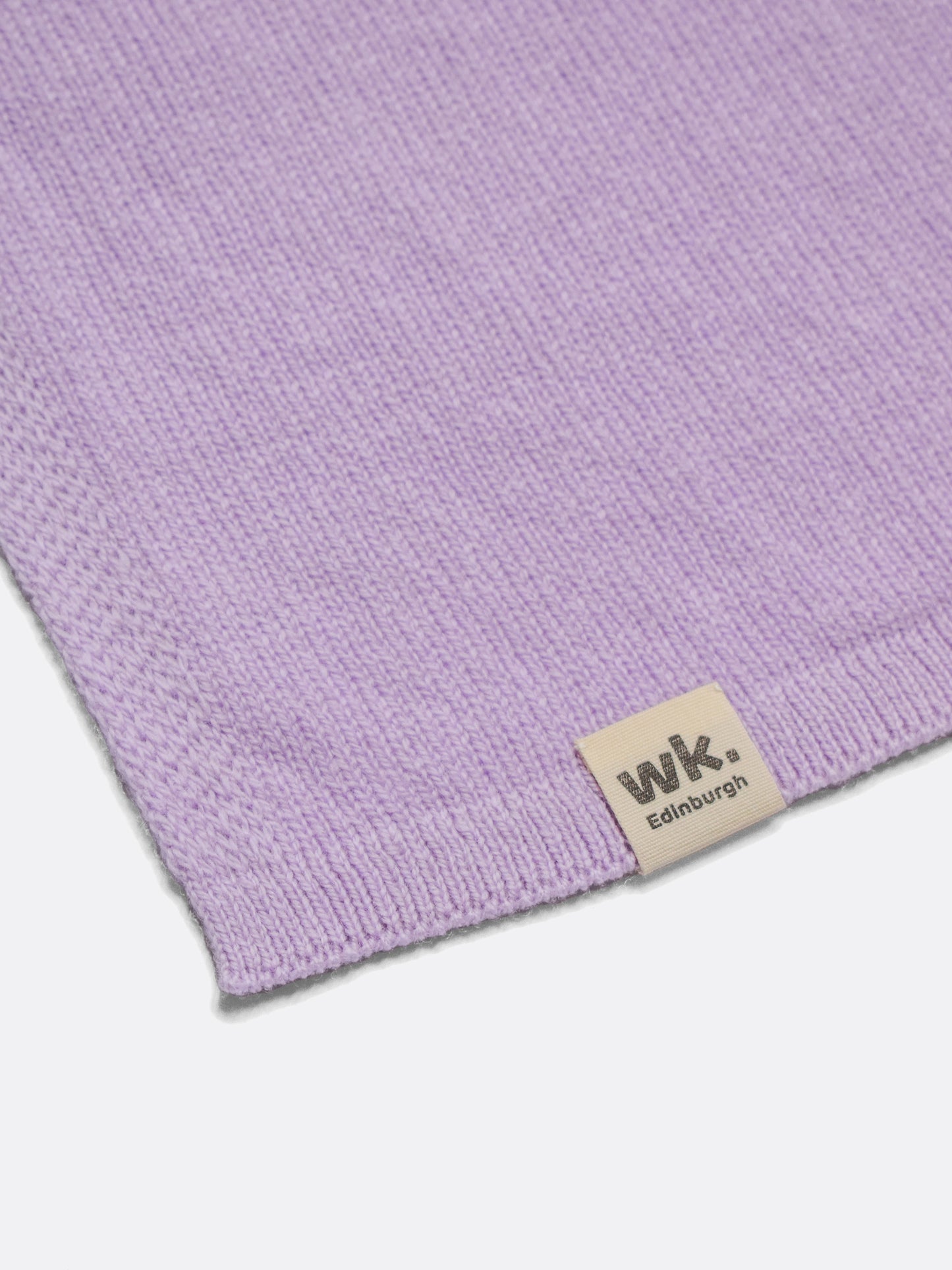 a swatch of plain single jersey knitting made from fine merino wool in a lilac colour