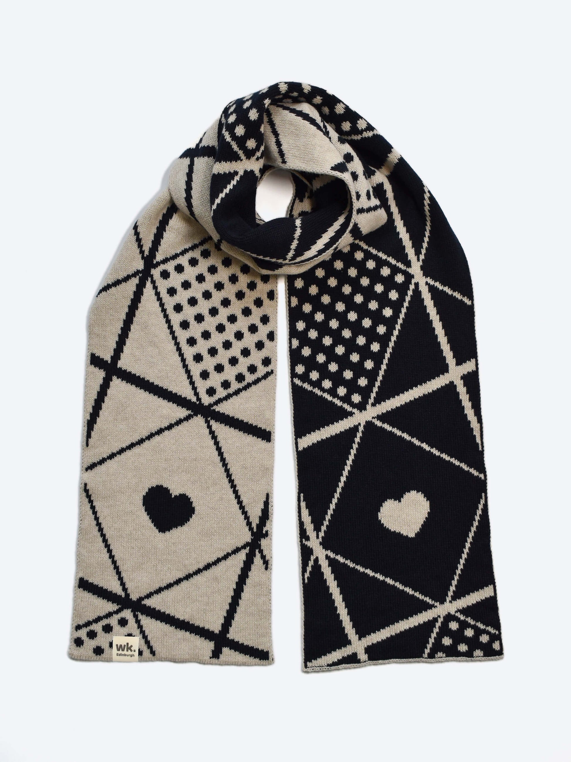 Navy and beige merino wool Sanquhar Scarf with geometric pattern and heart shapes on a white background