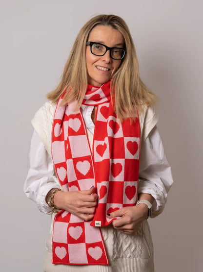 woman wearing merino wool love heart scarf in red and white - Woolkind
