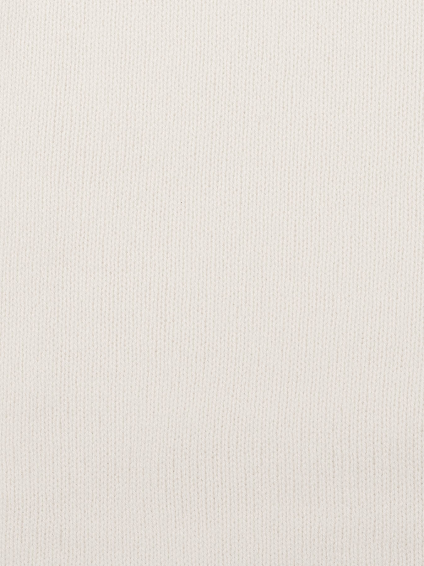a swatch of plain single jersey knitting made from fine merino wool in a white colour